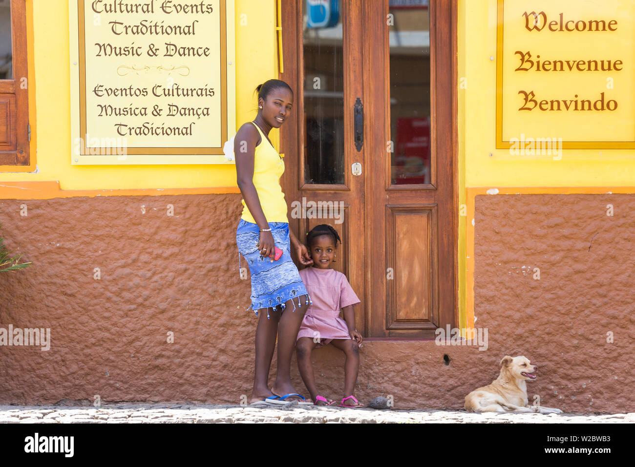 Mother & daughter outside restaurant & cultural centre, Cidade Velha, Santiago Island, Cape Verde Stock Photo