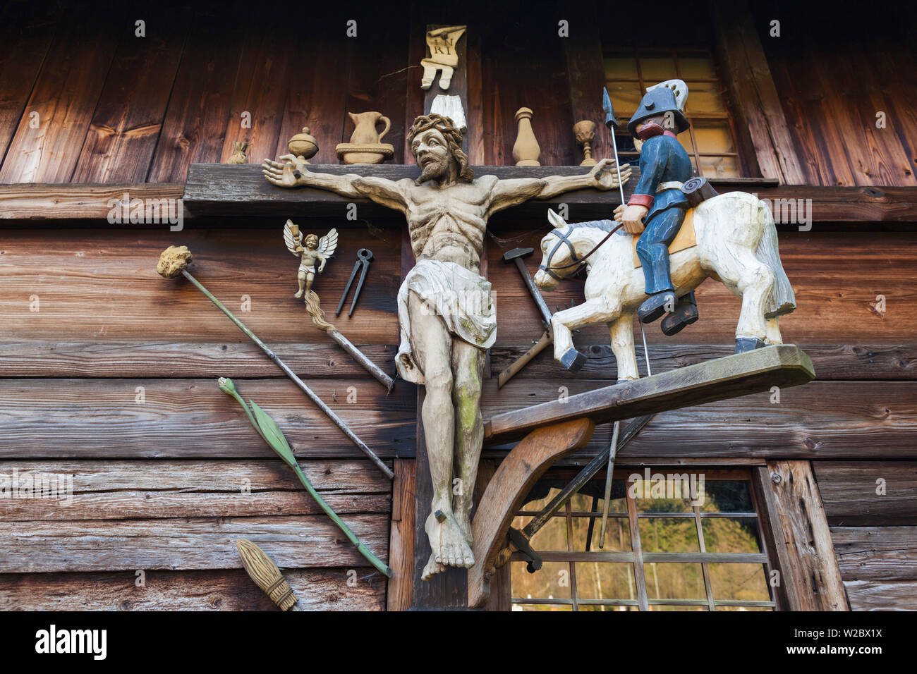 Germany, Baden-Wurttemburg, Black Forest, Haslach im Kinzigtal, Blackforest Outdoor Farm Museum, farmhouse detail with crucifix Stock Photo