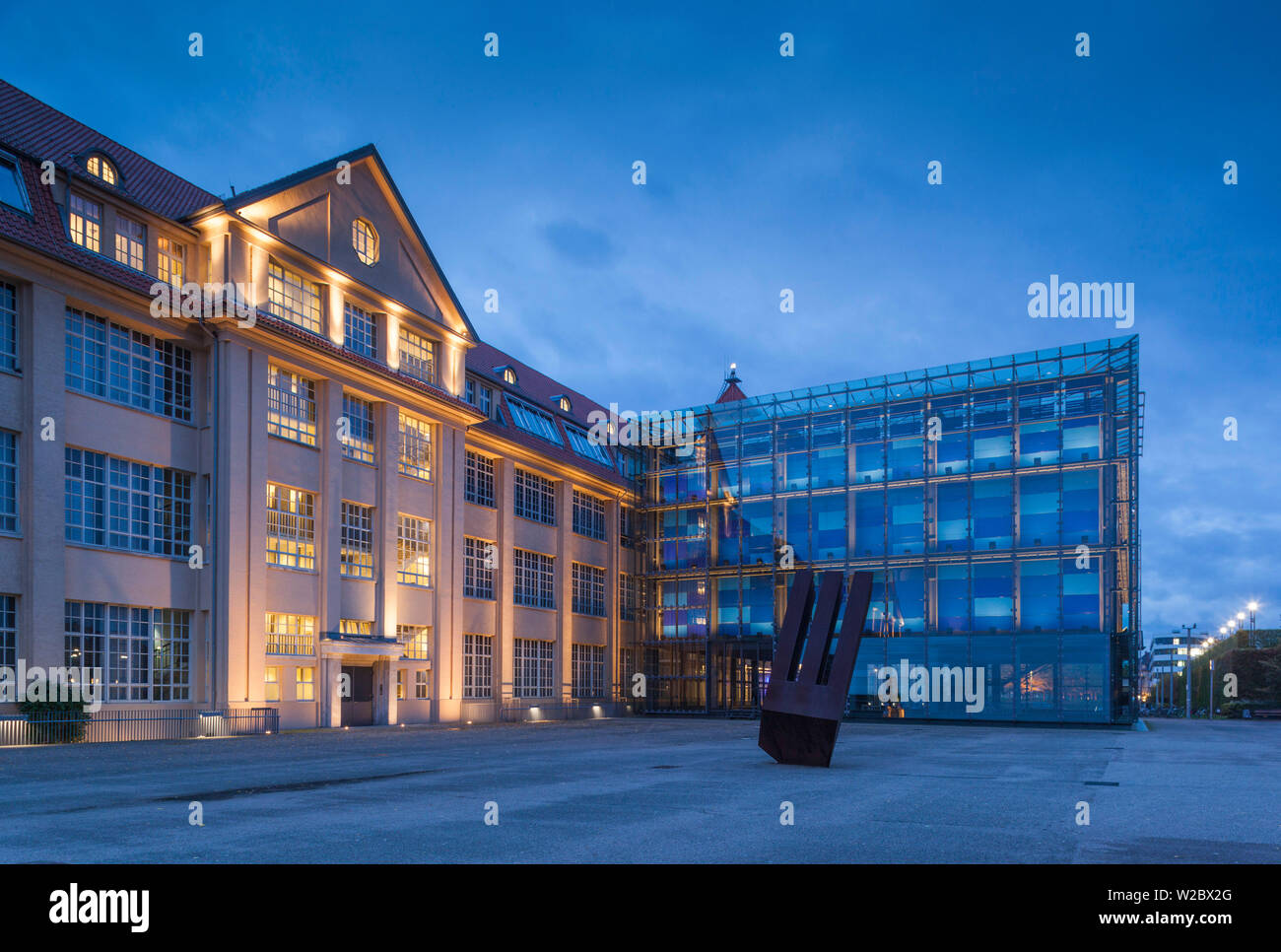 Germany, Baden-Wurttemburg, Karlsruhe, ZKM, Zentrum fur Kunst und Medientechnologie, modern art museum in former WW1-era munitions factory, exterior, dusk Stock Photo