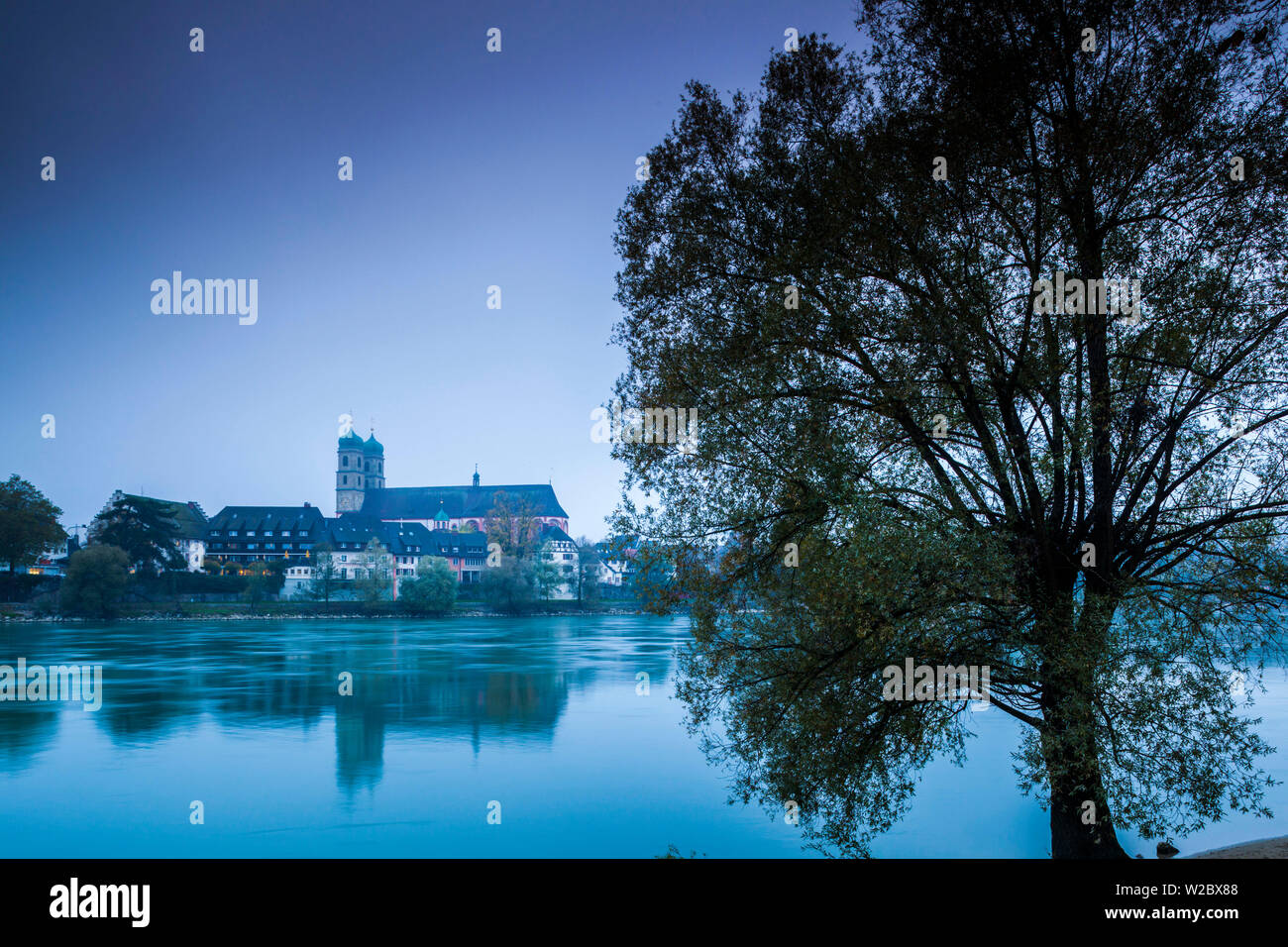 Germany, Baden-Wurttemburg, Black Forest, Bad Sackingen, Munster St. Fridolin cathedral and Rhein River, morning Stock Photo