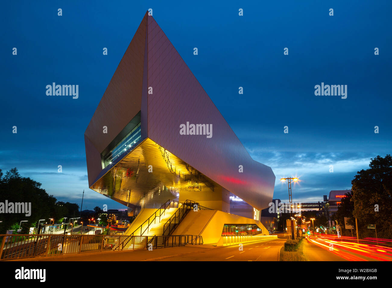 Porsche Museum illuminated at dusk, Stuttgart, Baden-Wurttemberg, Germany Stock Photo