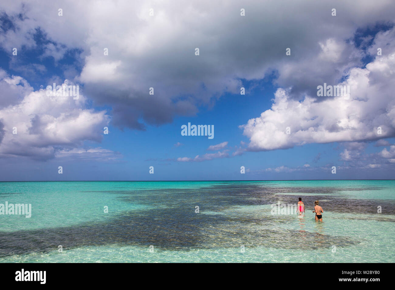 Dominican Republic, Punta Cana, Parque Nacional del Este, Piscina natural, a shallow sandbank, Tourists looking at starfish Stock Photo