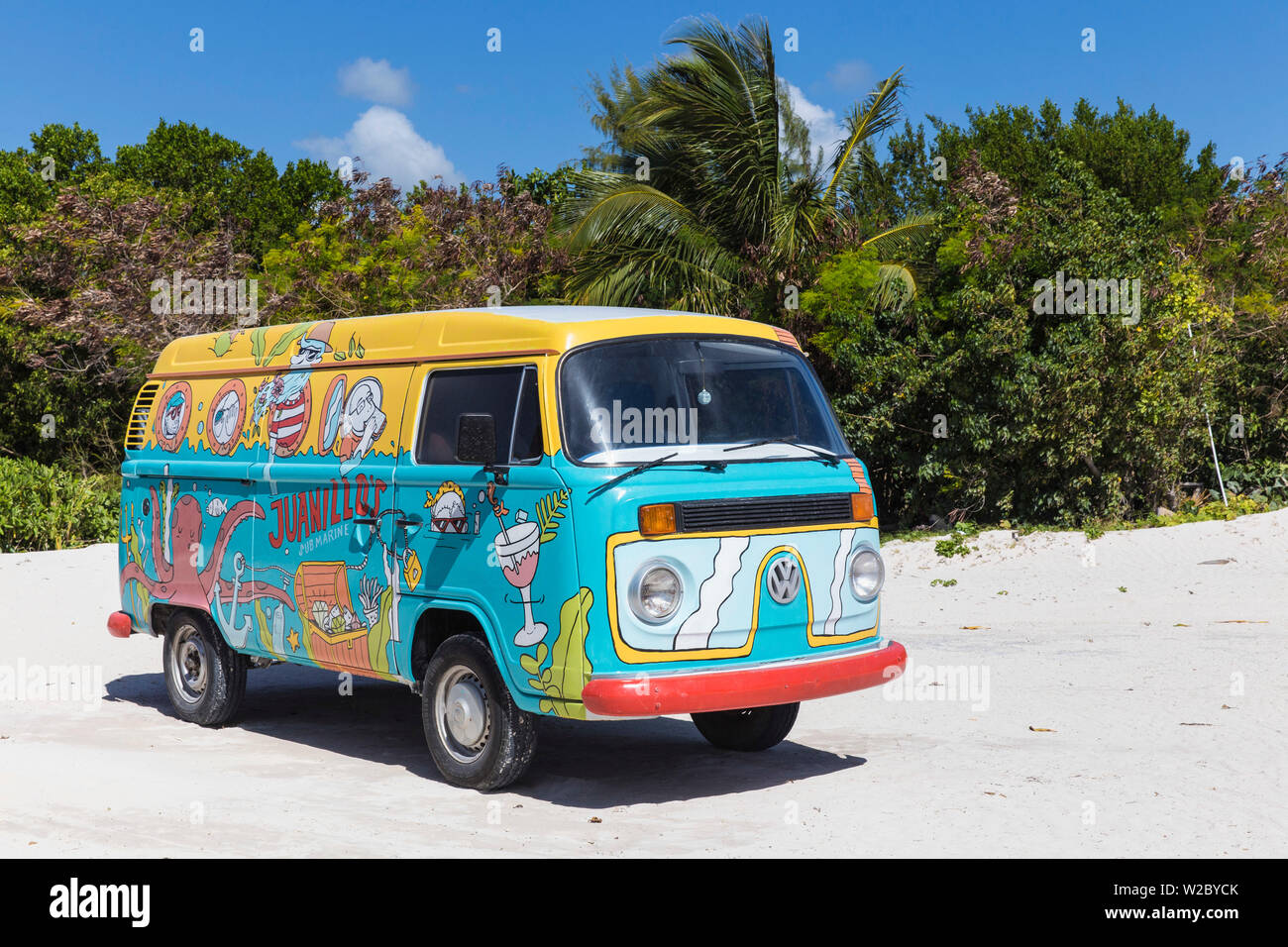 Dominican Republic, Punta Cana, Cap Cana, Colourful Volkswagen van parked on Juanillo Beach Stock Photo