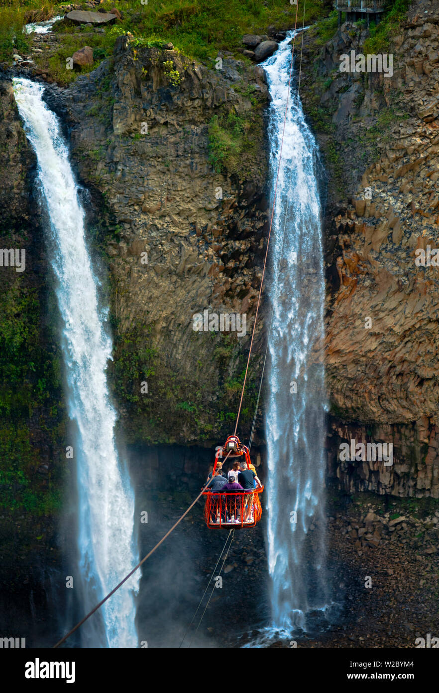 Tourists Ride A Cable Car Or Tarabita Over The Rio Pastaza Valley