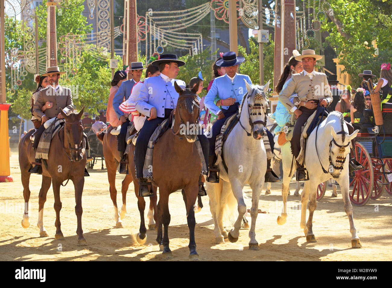 Horse Riders in Traditional Spanish Costume, Annual Horse Fair, Jerez de la Frontera, Cadiz Province, Andalusia, Spain Stock Photo