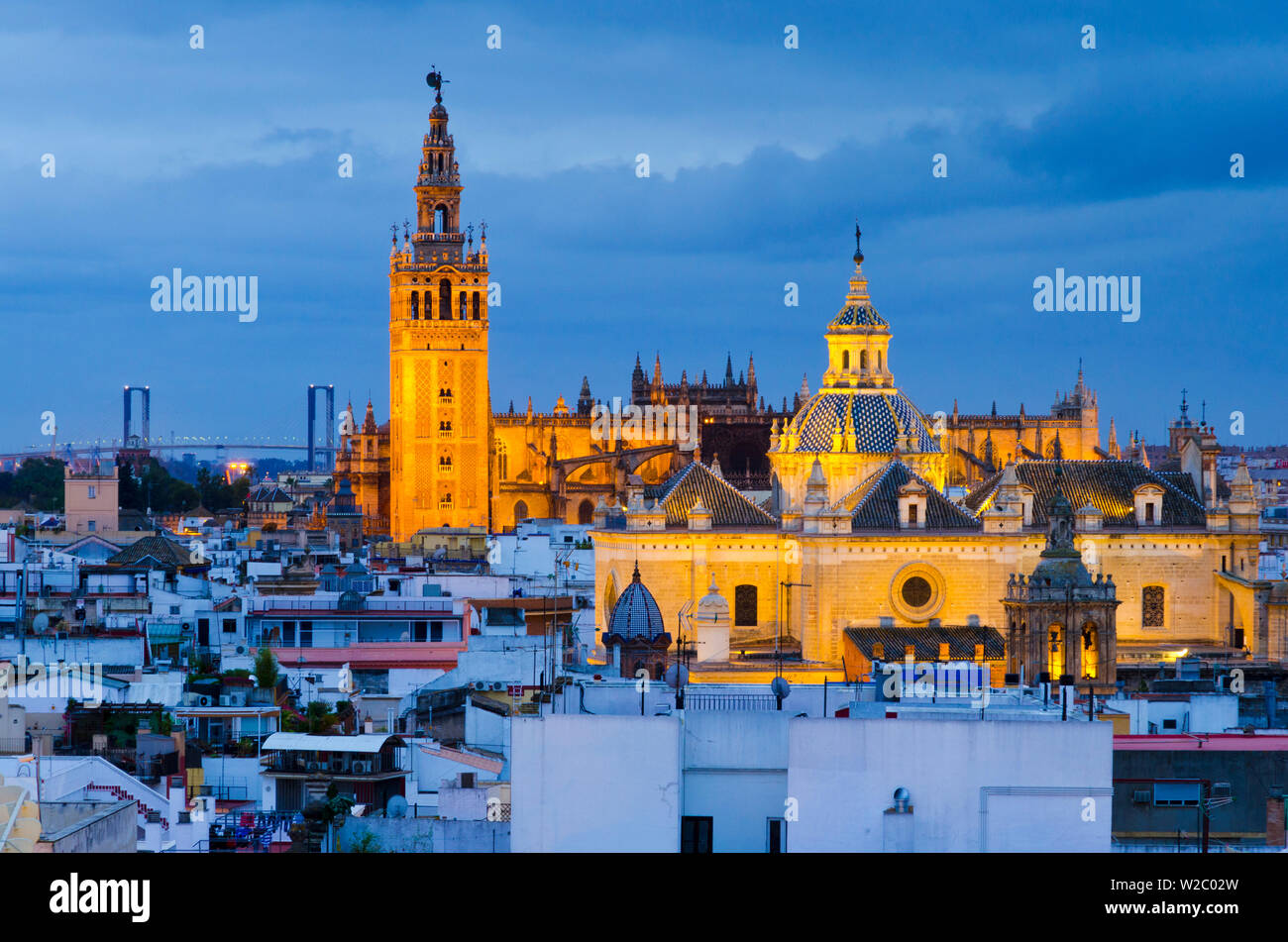 Spain, Andalucia, Seville Province, Seville,  Cathedral of Seville, The Giralda Tower (La Giralda) and Church of the Saviour (Iglesia del Salvador) Stock Photo