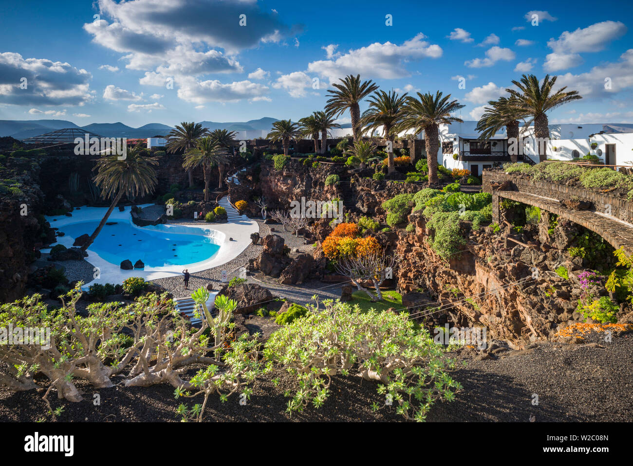 Spain, Canary Islands, Lanzarote, Jameos del Agua, complex inside old lava tube, designed by Cesar Manrique, exterior pool Stock Photo