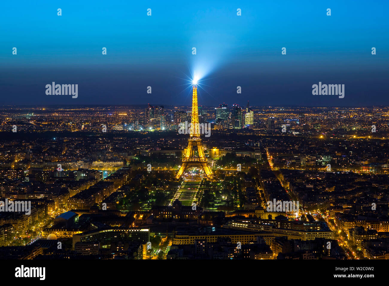 Elevated view of the Eiffel Tower, city skyline and La Defence skyscrapper district in the distance, Paris, France, Europe Stock Photo