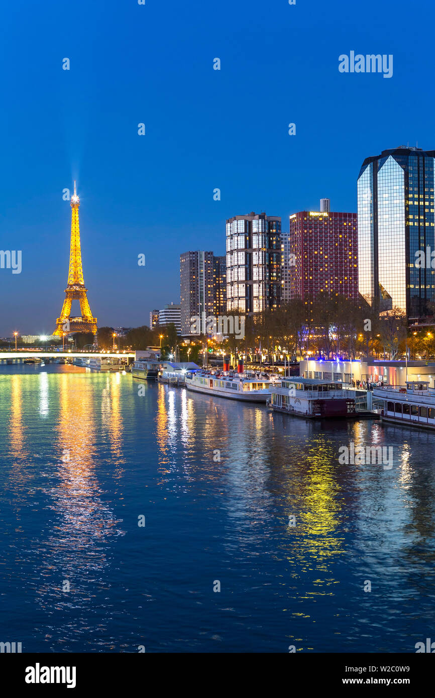 Night view of River Seine with high-rise buildings on the Left Bank, and Eiffel Tower, Paris, France, Europe Stock Photo