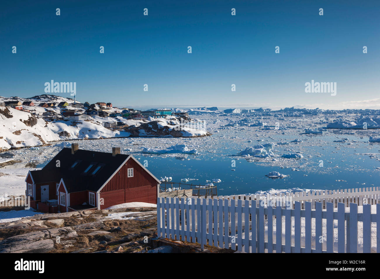 Greenland, Disko Bay, Ilulissat, elevated town view with floating ice Stock Photo