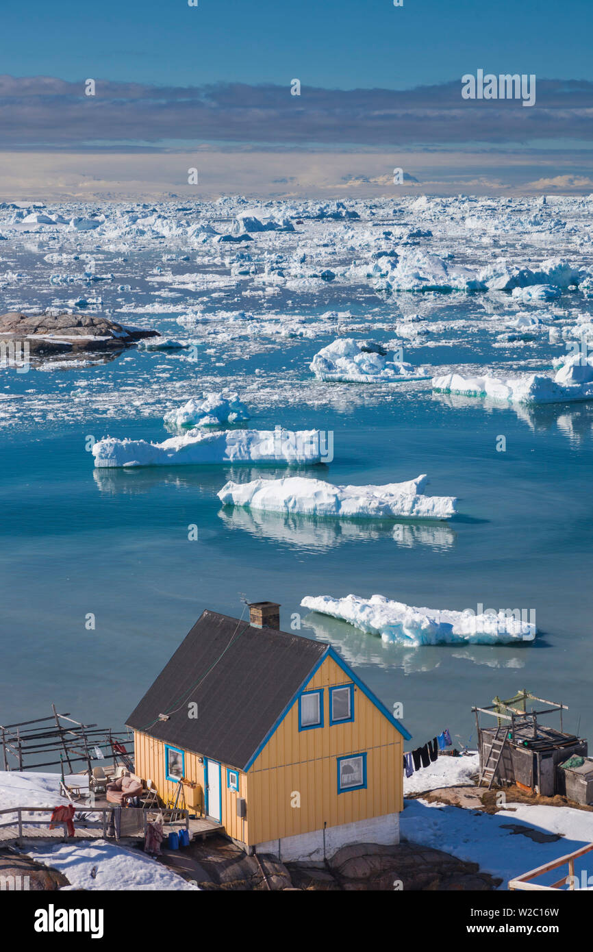 Greenland, Disko Bay, Ilulissat, elevated town view with floating ice Stock Photo