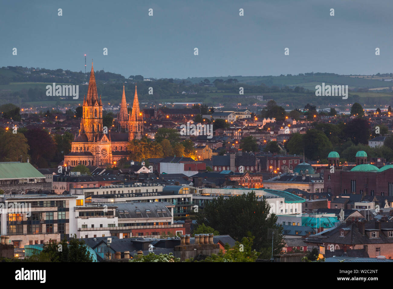 Ireland, County Cork, Cork City, St. Fin Barre's Cathedral, 19th century, elevated view, dusk Stock Photo