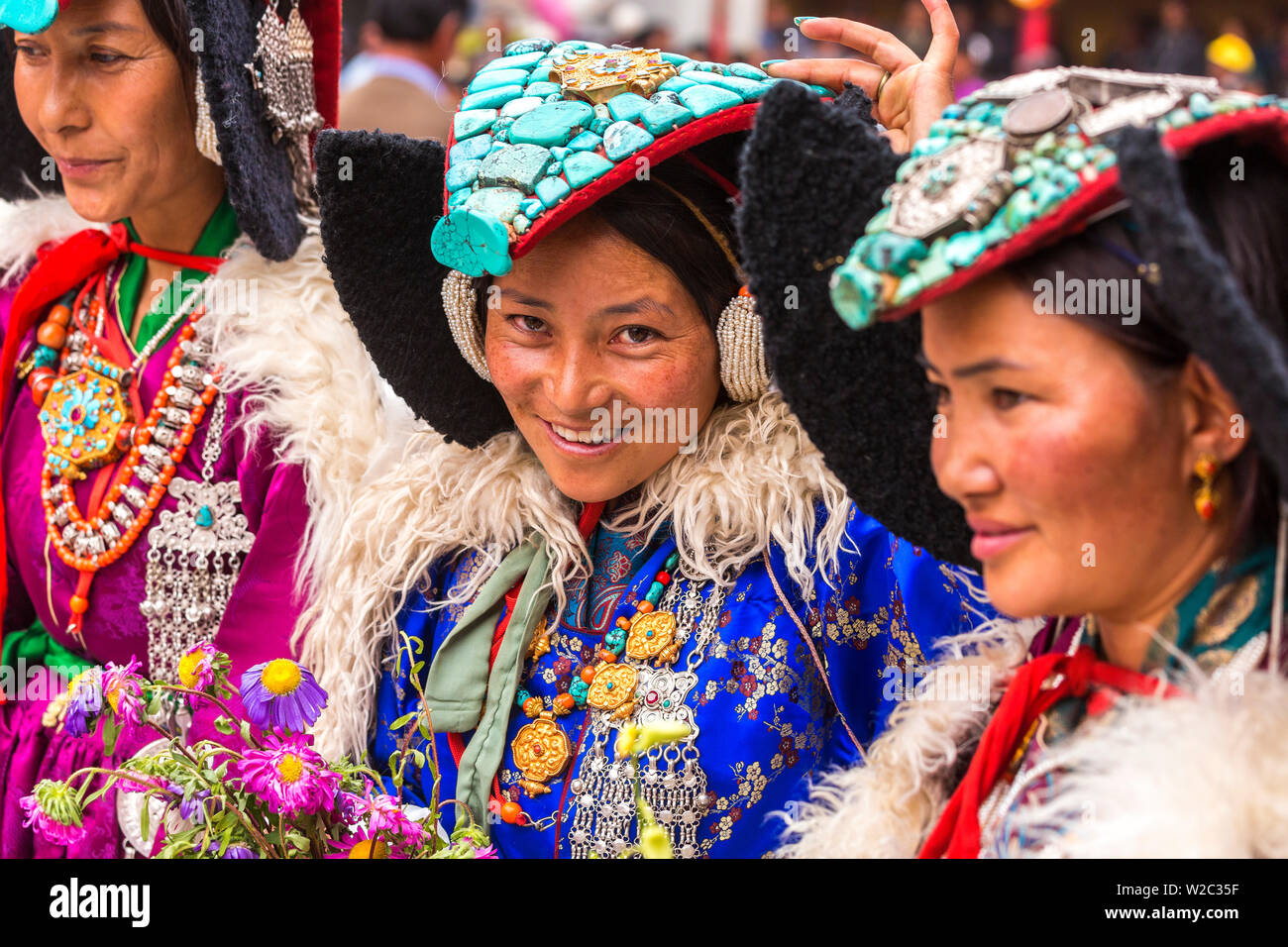 Ladakhi women in traditional clothing with turquoise head dress Ladakh India Stock Photo