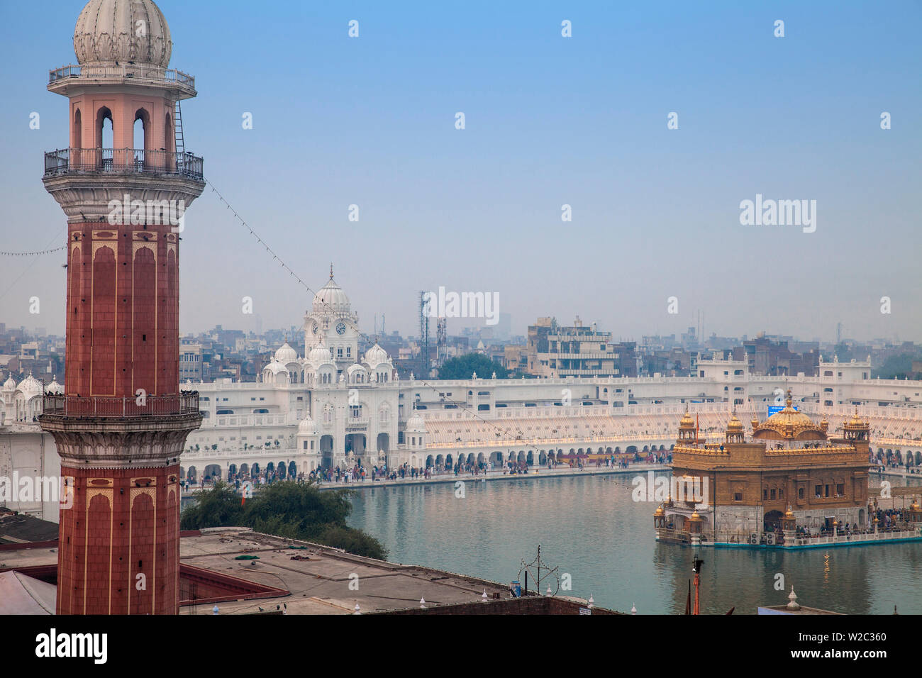 India, Punjab, Amritsar, Pilgrims at The Harmandir Sahib, known as The Golden Temple Stock Photo