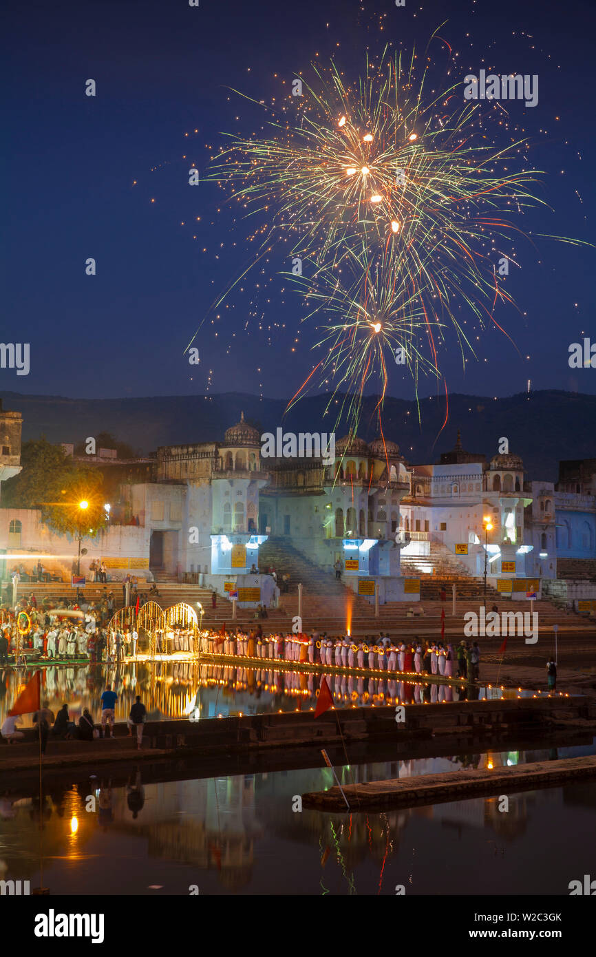 India, Rajasthan, Pushkar, Fireworks at  lakeside ceremony during Pushkar Camel Fair Stock Photo