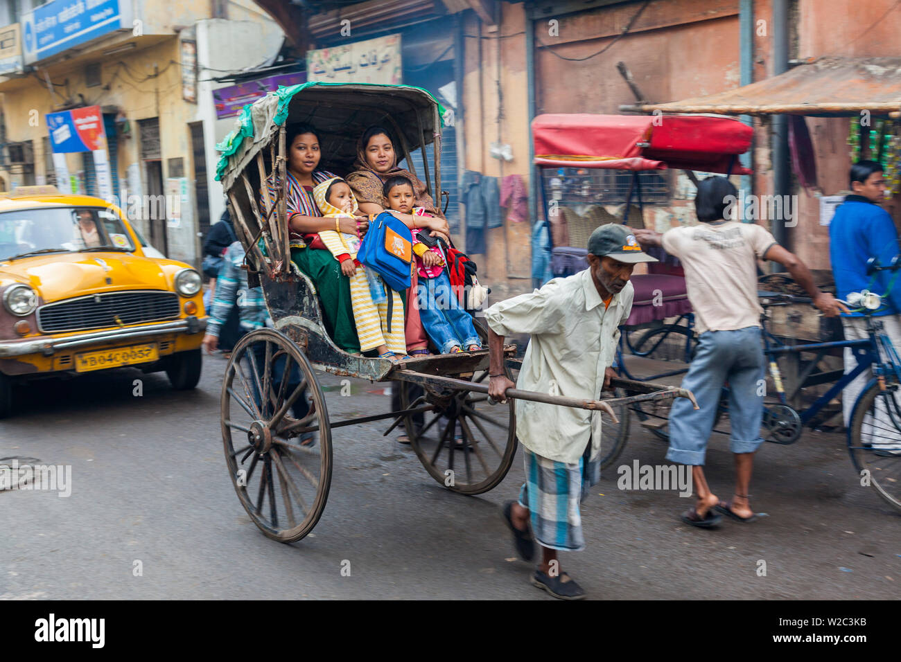 Hand pulled rickshaw, central Kolkata (Calcutta), West Bengal, India Stock Photo