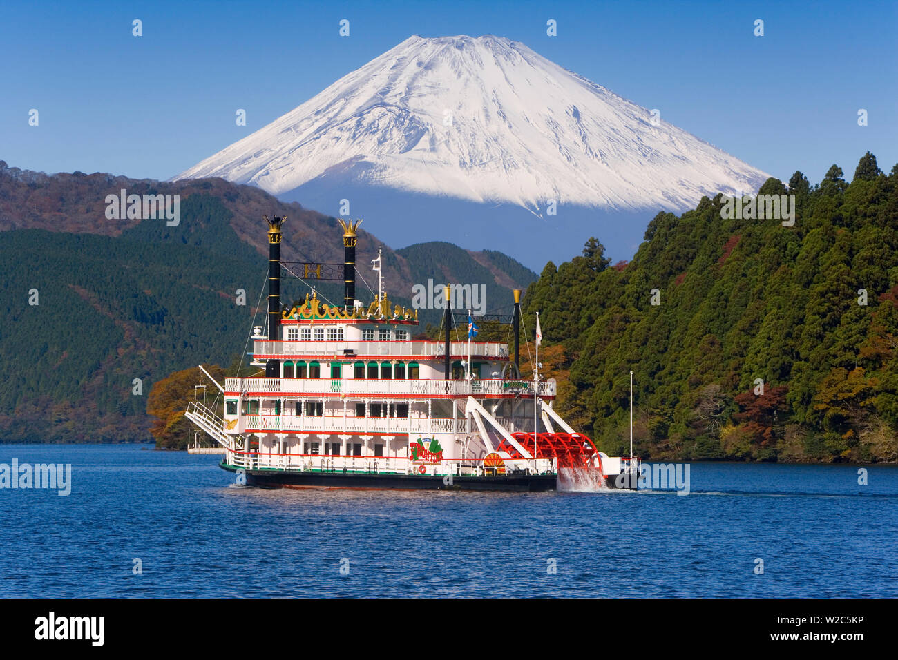 Japan, Central Honshu (Chubu), Fuji-Hakone-Izu National Park, Hakone, Tourist pleasure boat in front of Mount Fuji (3776m) snow capped and viewed across lake Ashino-ko Stock Photo