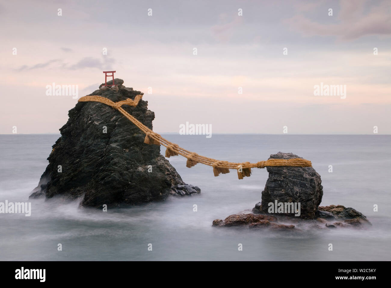 Japan, Central Honshu (Chubu), Ise-Shima, Futami, Meoto-Iwa (Wedded Rocks), these two rocks are considered to be male and female and have been joined in matrimony by shimenawa (sacred ropes), which are renewed in a special festival each year Stock Photo