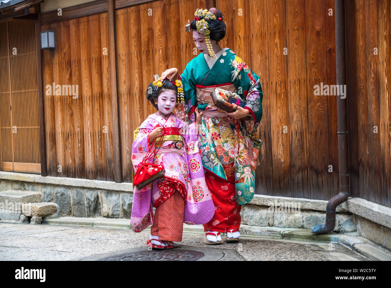 Woman & child dressed in traditional geisha dress, Kyoto, Japan Stock Photo