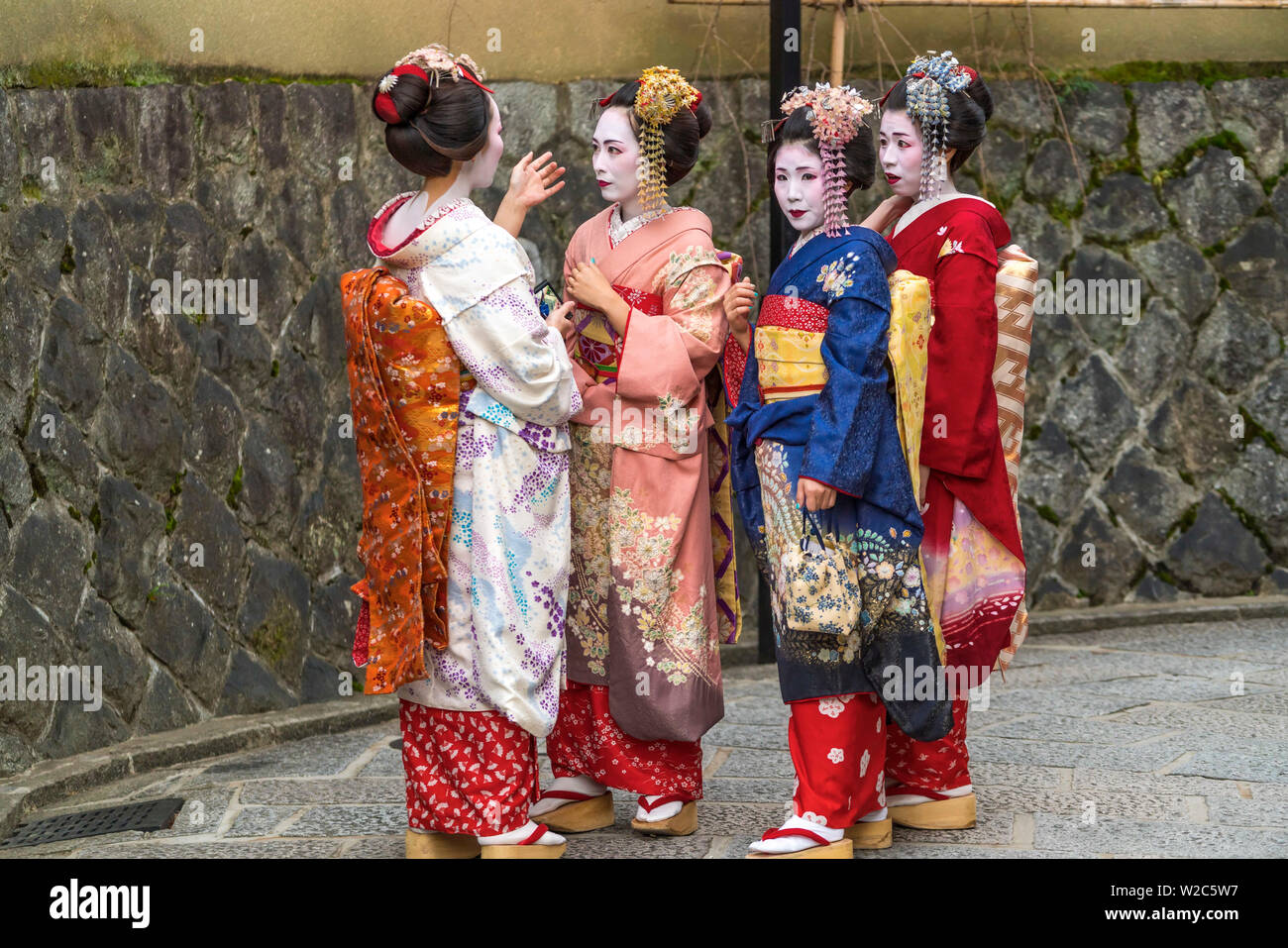 Women dressed in traditional geisha dress, Kyoto, Japan Stock Photo
