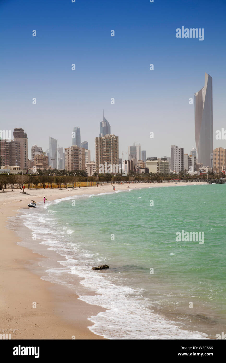 Kuwait, Kuwait City, Salmiya, Arabian Gulf beach and City skyline looking towards Al Hamra Tower Stock Photo