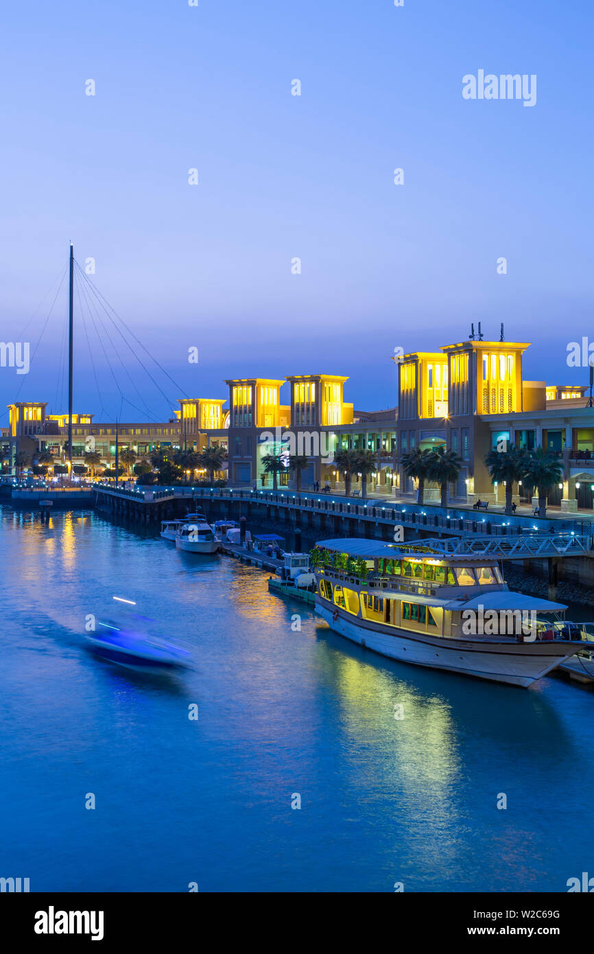 Kuwait, Kuwait City, Souk Shark Mall and Kuwait harbour, illuminated at dusk Stock Photo