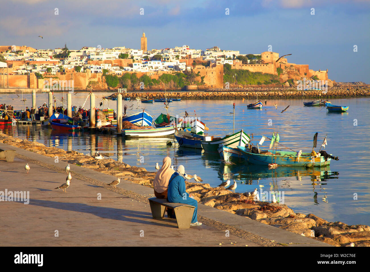 Harbour and Fishing Boats with Oudaia Kasbah and Coastline in Background, Rabat, Morocco, North Africa Stock Photo