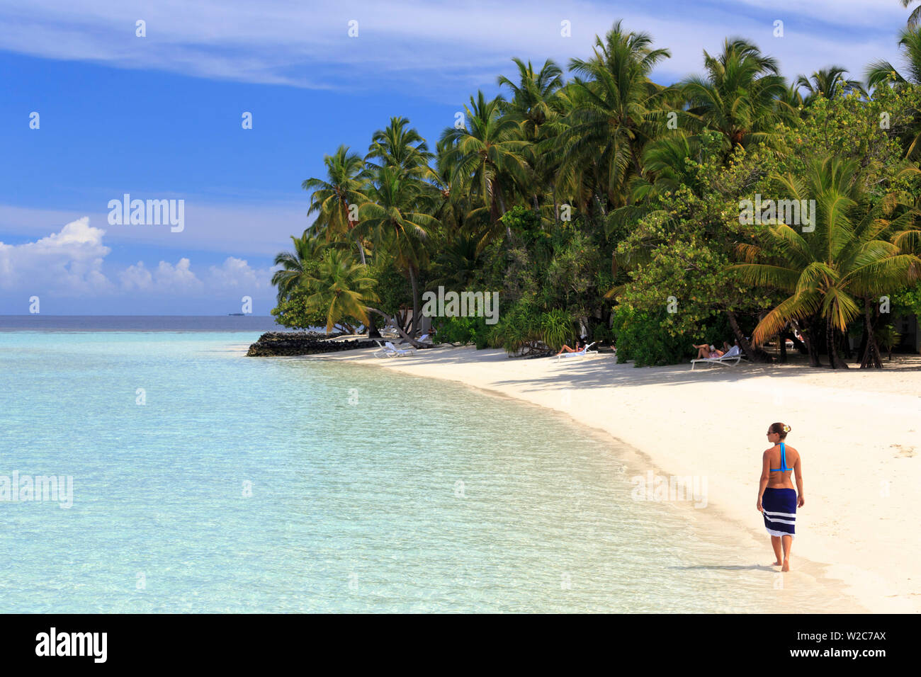 Maldives, South Ari Atoll, Athuruga Island, Diamonds Athuruga Resort, young woman on the beach (MR) Stock Photo