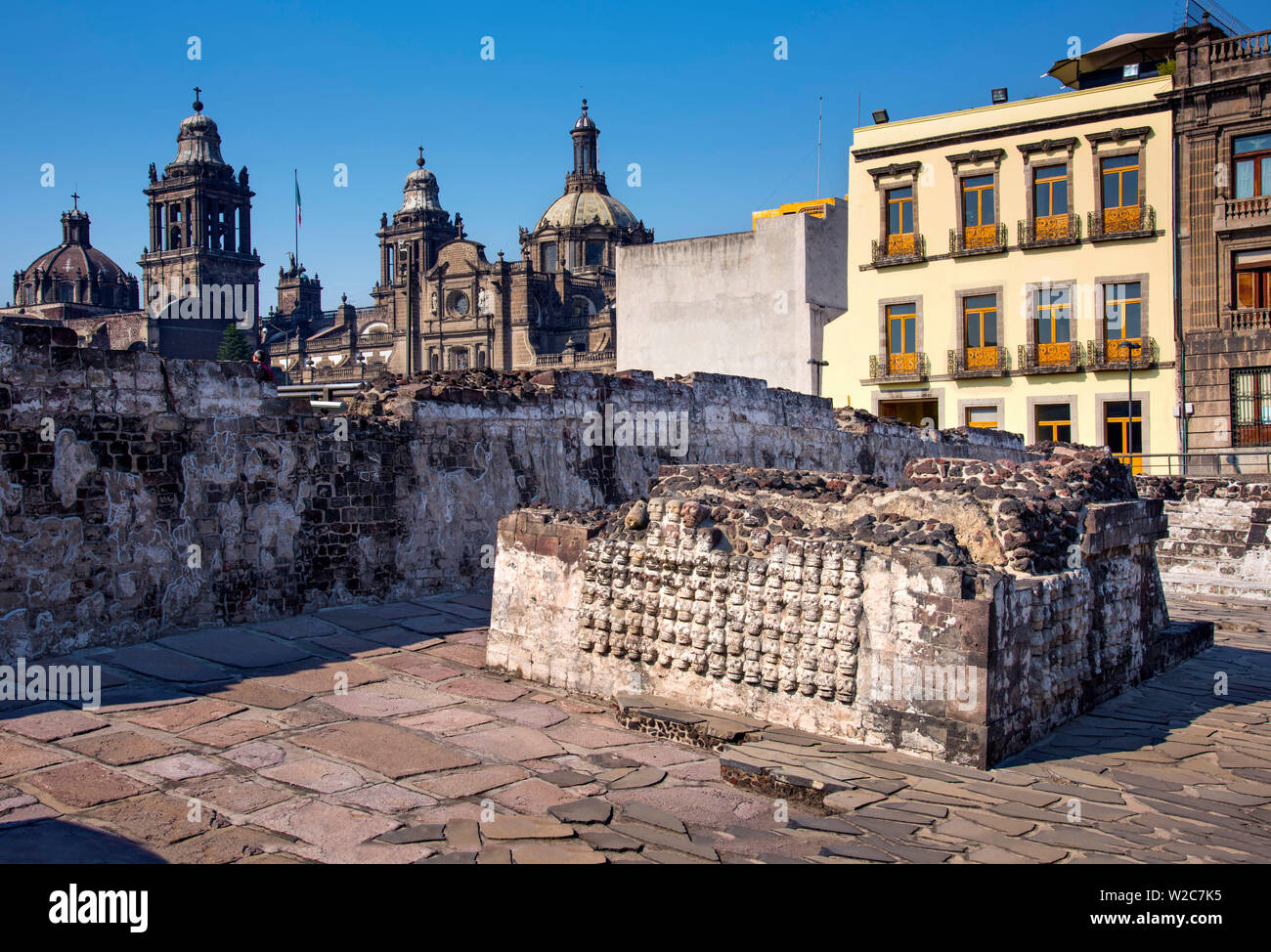 Mexico, Mexico City, Aztec, Templo Mayor, Great Temple, Wall of Skulls, Metropolitan Cathedral in Background, Centro Historico Stock Photo