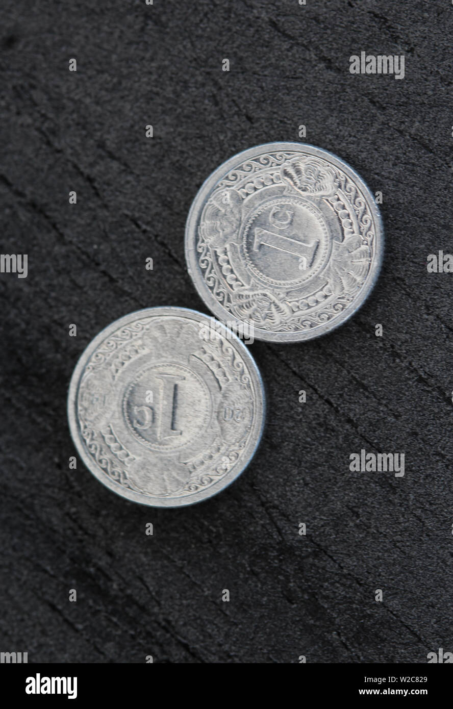 close up of 10 (ten) cent Netherlands Antillean guilder coin on black background Stock Photo