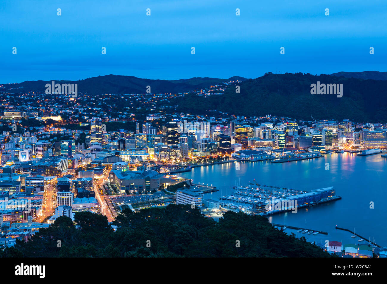 Elevated view over central Wellington illuminated at dusk, Wellington, North Island, New Zealand Stock Photo