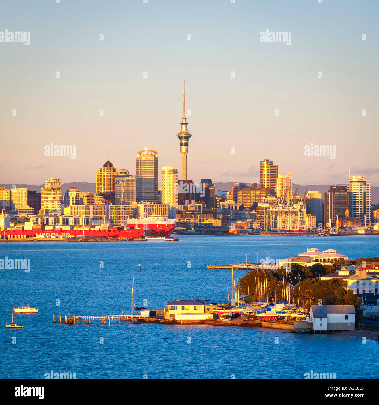 Elevated View Over Devenport towards CBD illuminated at sunrise, Auckland, New Zealand Stock Photo