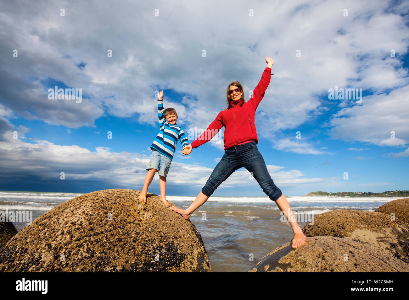 Mother and son at the Moeraki Boulders, South Island, New Zealand Stock Photo