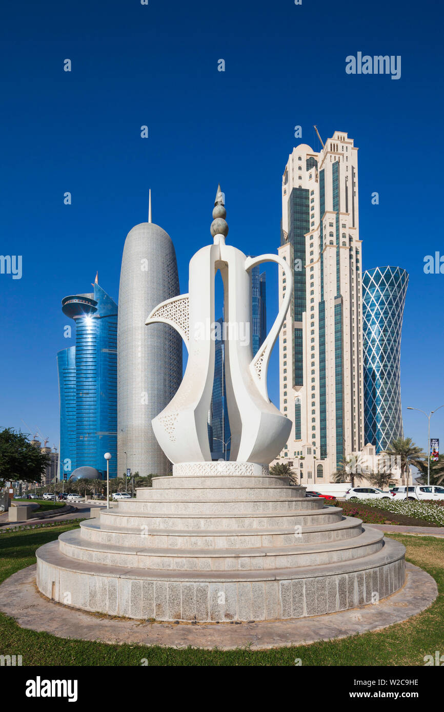 Qatar, Doha, Doha Bay, West Bay Skyscrapers, morning, with large coffeepot sculpture Stock Photo