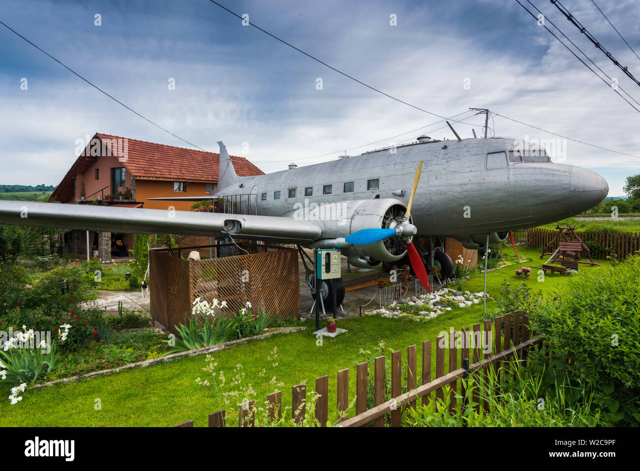 Romania, Transylvania, Faget, Russian-built Lisunov Li-2 aircraft, licensed copy of US-built DC-3, used as cabana next to private house Stock Photo
