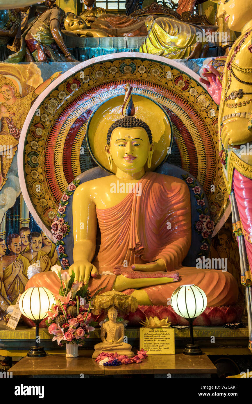 Statue of sitting Buddha a Gangaramaya temple in Colombo, Sri Lanka Stock Photo