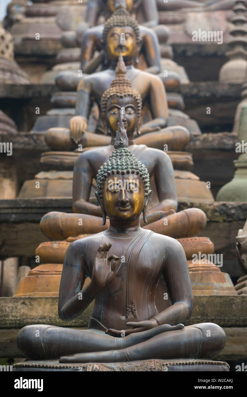 Statues of sitting Buddhas a Gangaramaya temple in Colombo, Sri Lanka Stock Photo