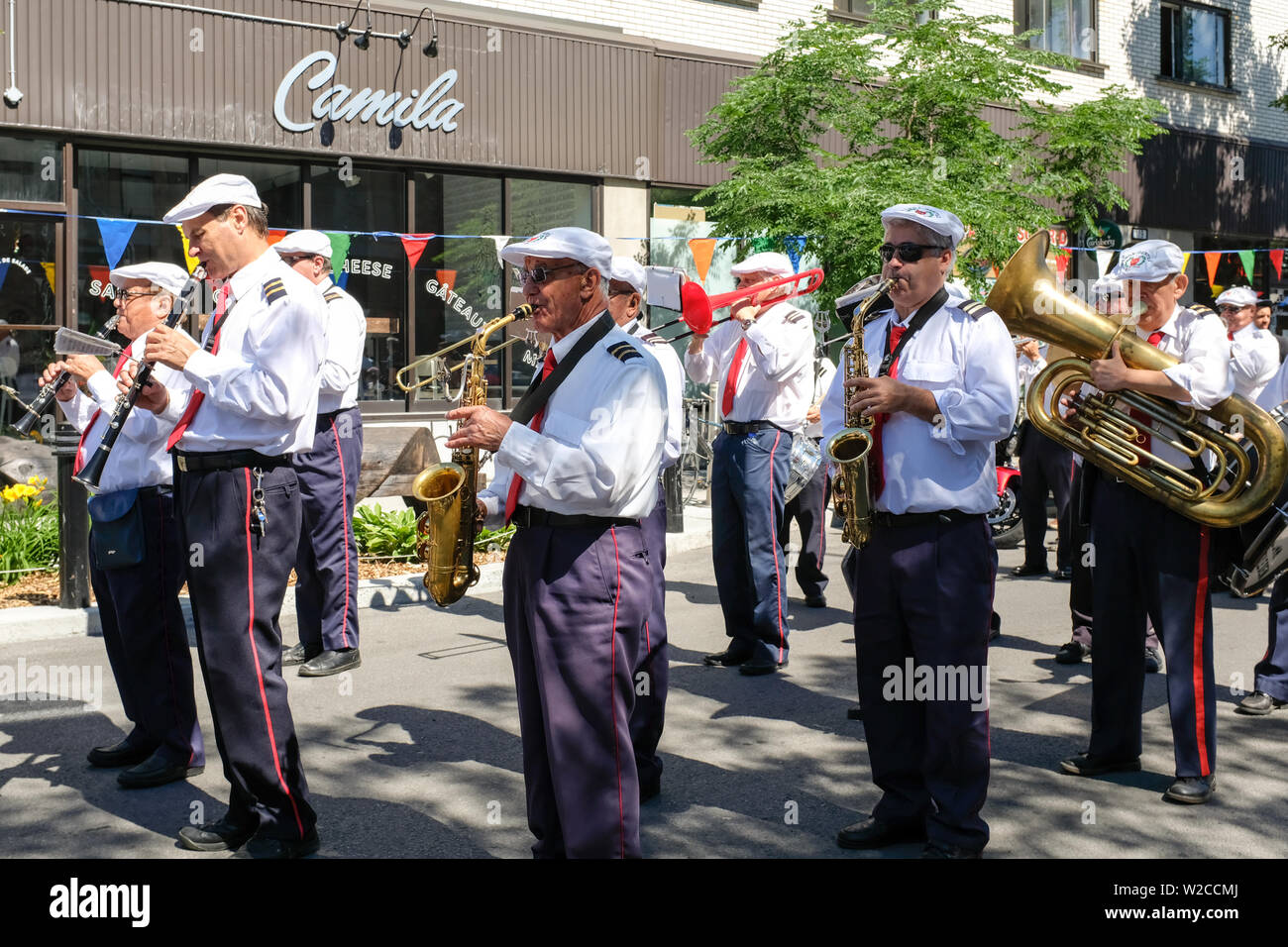 Marching Band from Italian origin playing in Mile End Montreal Stock Photo