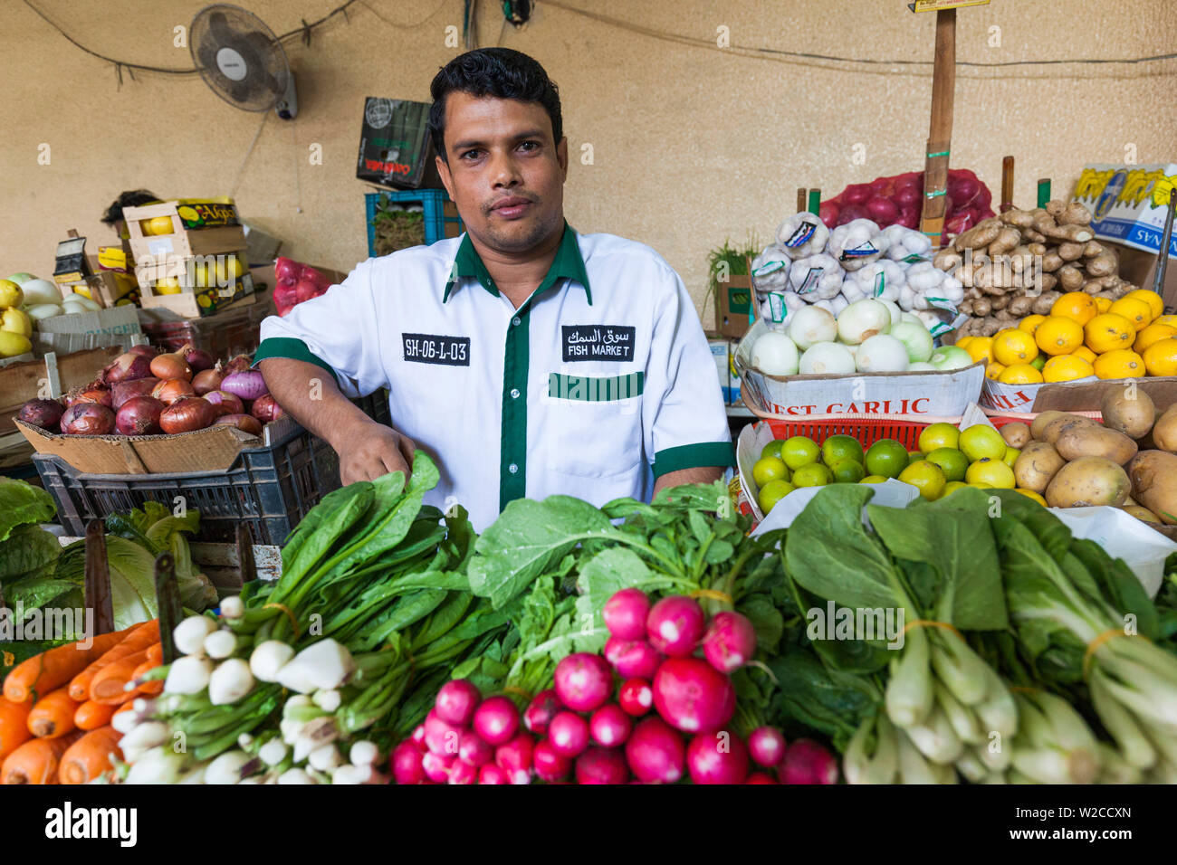 UAE, Dubai, Deira, Dubai Produce Market, produce vendor Stock Photo