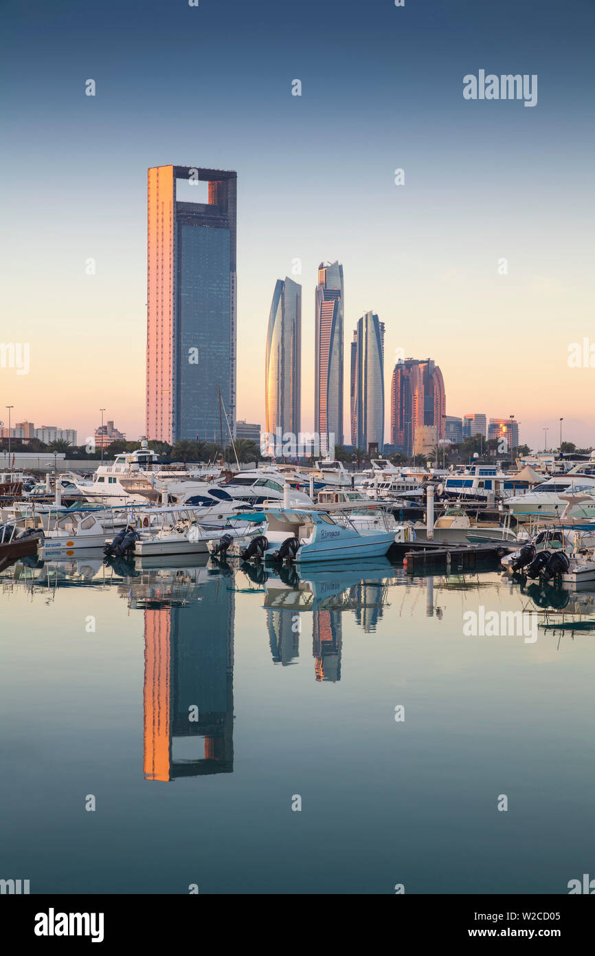 United Arab Emirates, Abu Dhabi, View of Marina and City skyline looking towards Abu Dhabi National Oil Company headquarters, Etihad Towers, and The Royal Rose Hotel Stock Photo