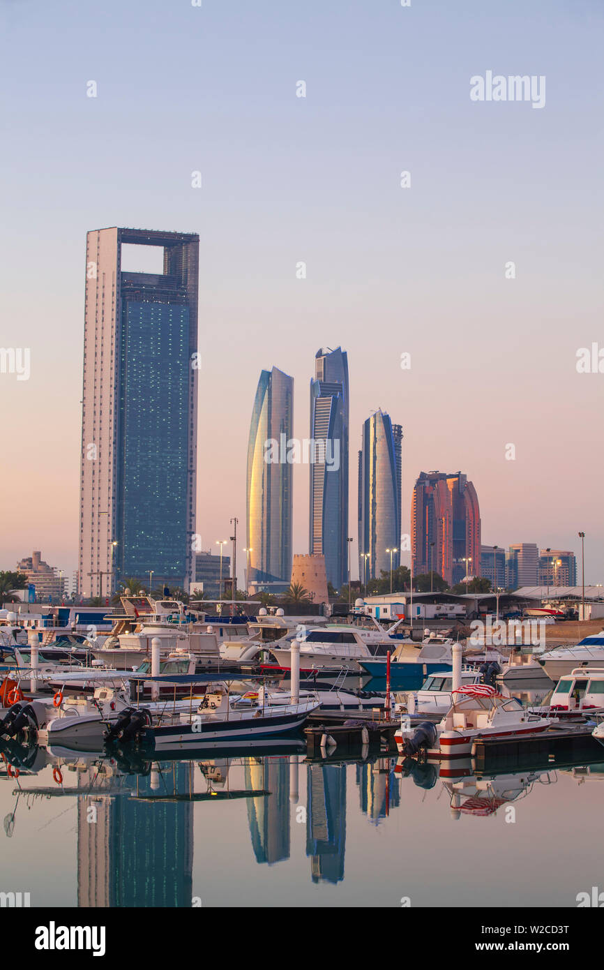 United Arab Emirates, Abu Dhabi, View of Marina and City skyline looking towards Abu Dhabi National Oil Company headquarters, Etihad Towers, and The Royal Rose Hotel Stock Photo