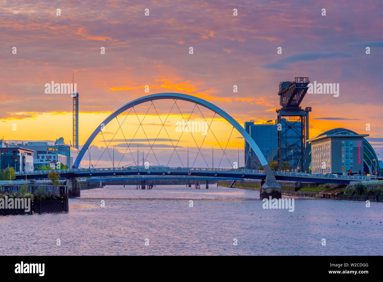 UK, Scotland, Glasgow, River Clyde, Finnieston Crane and the Clyde Arc, nicknamed the Squinty Bridge Stock Photo