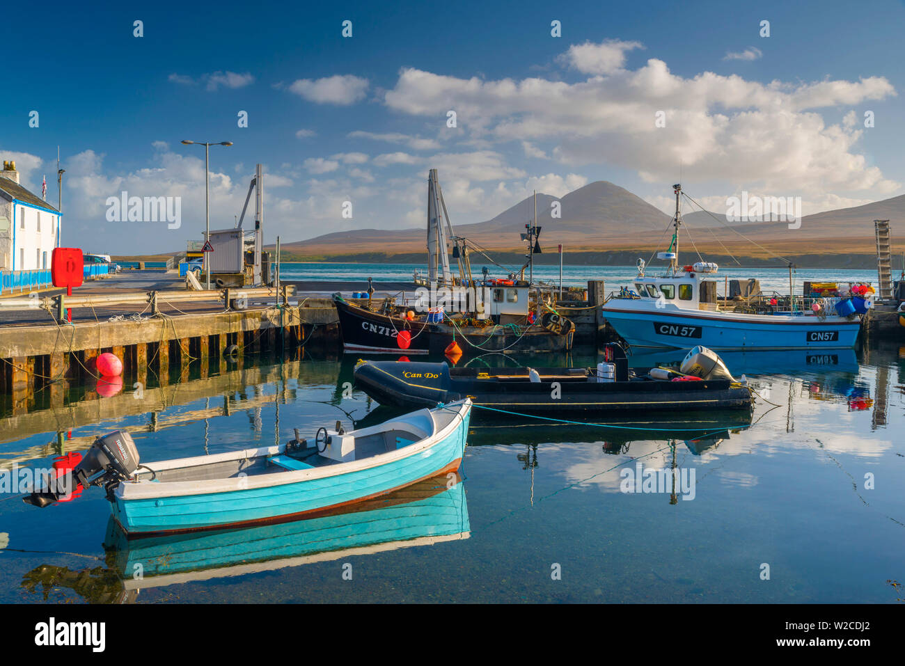 UK, Scotland, Argyll and Bute, Islay, Port Askaig with Isle of Jura, Paps of Jura mountains across Sound of Islay Stock Photo