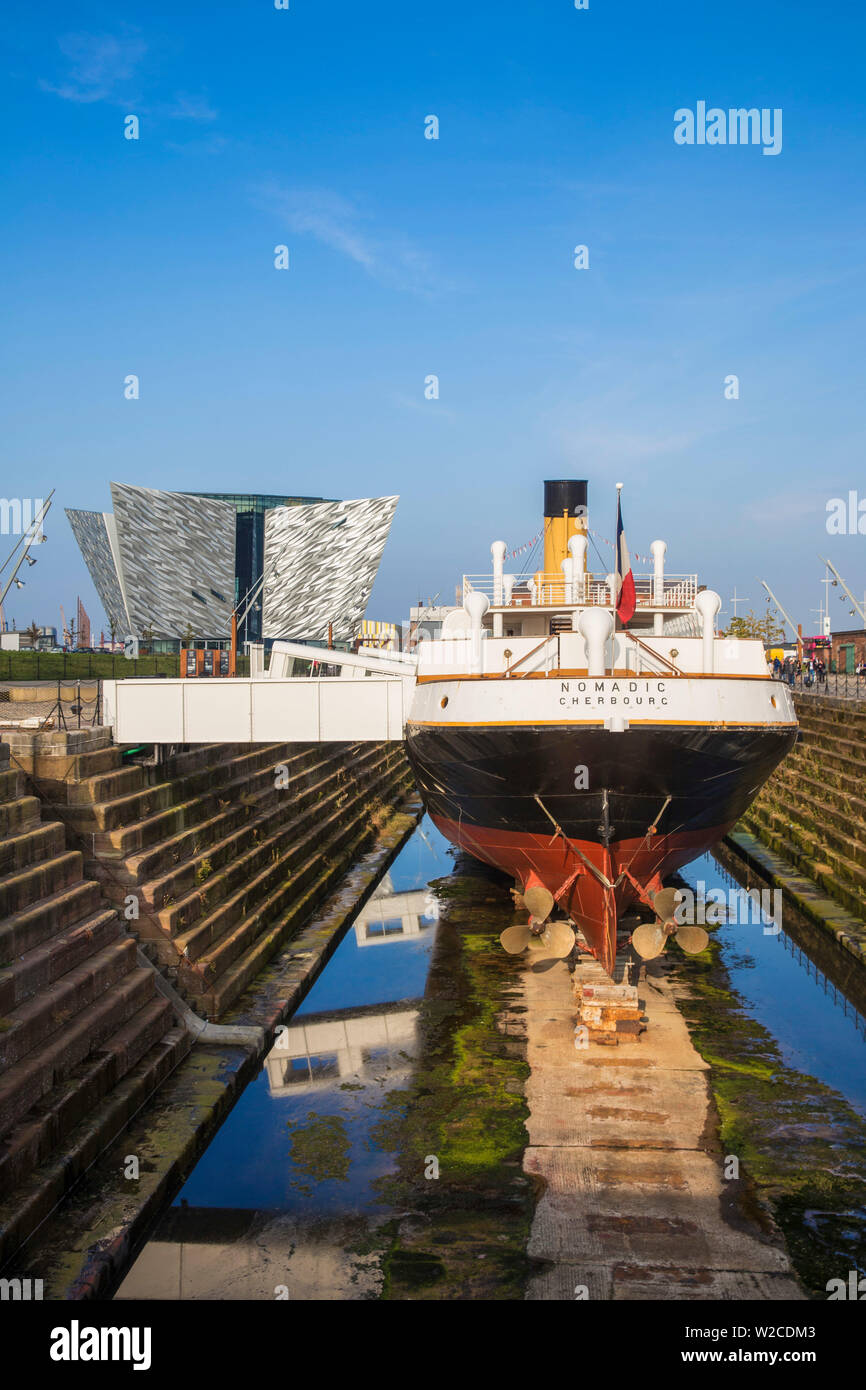United Kingdom, Northern Ireland, Belfast, The SS Nomadic - Tender to the Titanic and the last remaining White Star Line ship infront of the Titanic Belfast museum Stock Photo