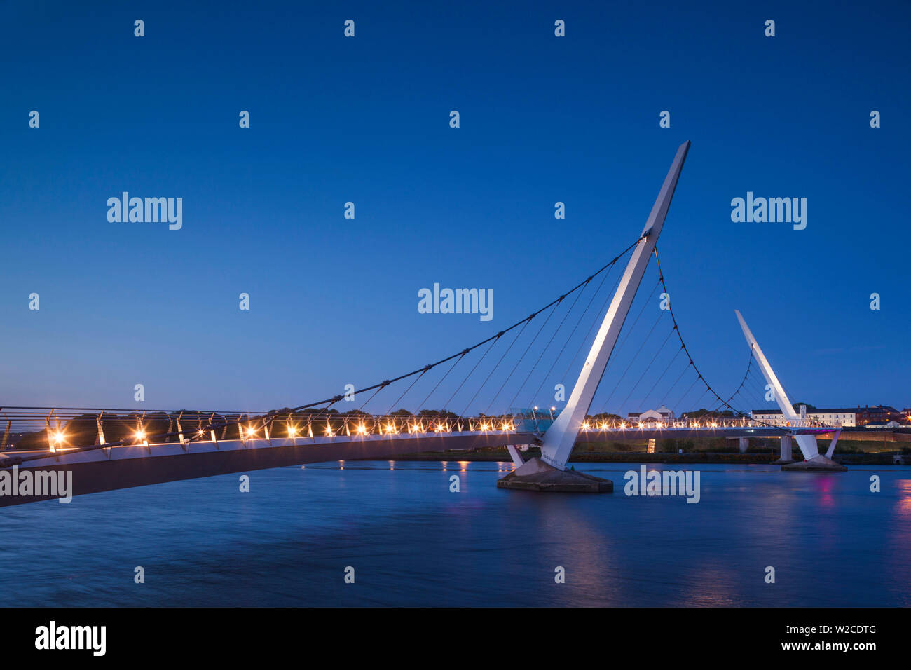 UK, Northern Ireland, County Londonderry, Derry, The Peace Bridge over the River Foyle, 2011, dusk Stock Photo