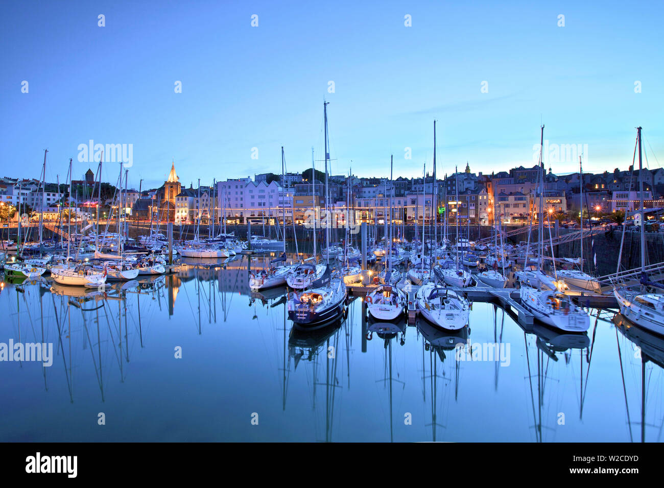 St. Peter Port Harbour At Night, Guernsey, Channel Islands Stock Photo