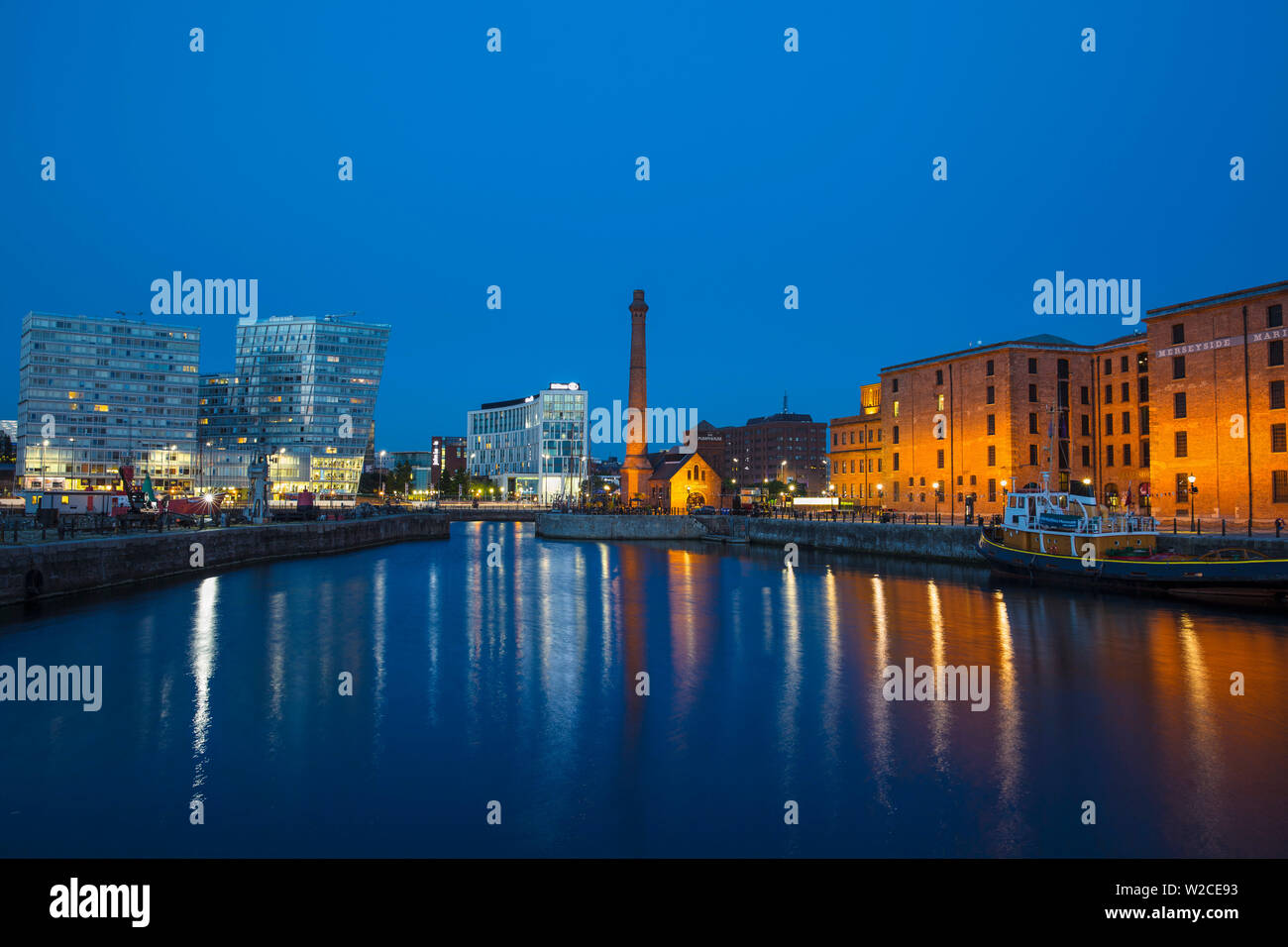 United Kingdom, England, Merseyside, Liverpool, Canning Dock, View of docks looking towards the Pump House and Hilton Hotel Stock Photo
