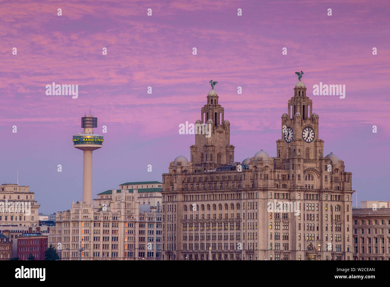 United Kingdom, England, Merseyside, Liverpool, View of The Royal Liver Building - with two clock towers topped by two Liver Birds, with Radio City Tower behind Stock Photo