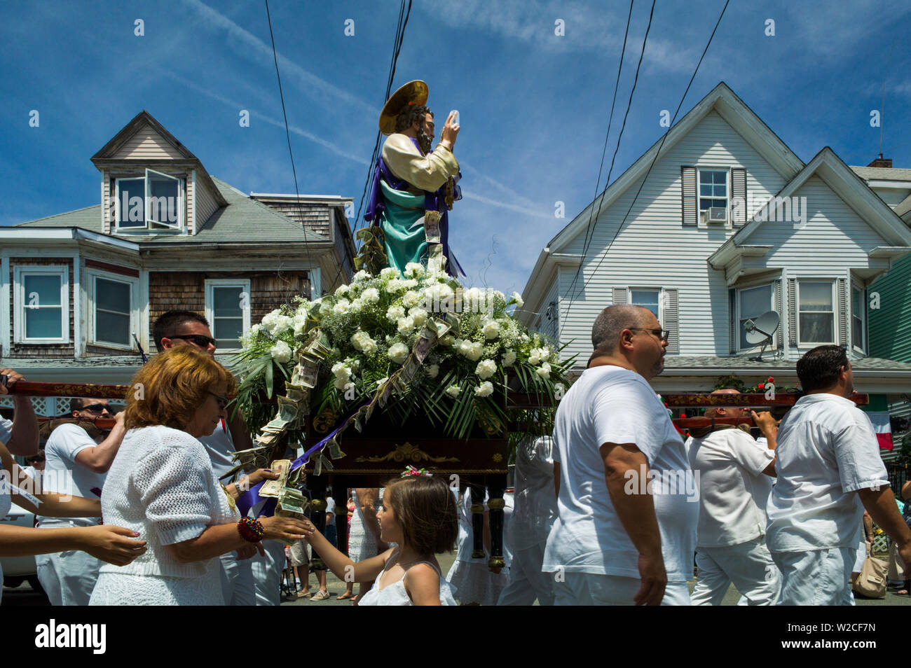 USA, Massachusetts, Cape Ann, Gloucester, Saint Peter's Fiesta, Festival to honor patron saint of fishermen, America's Oldest Seaport, men carrying Saint Peter statue Stock Photo