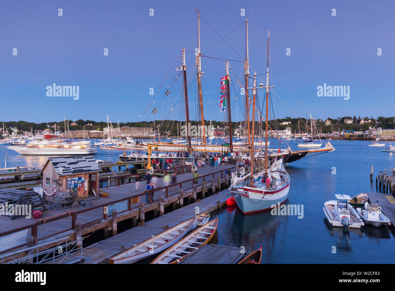 USA, Massachusetts, Cape Ann, Gloucester, annual Gloucester Schooner Festival, Maritime Center pier with Schooner Columbia, dusk Stock Photo